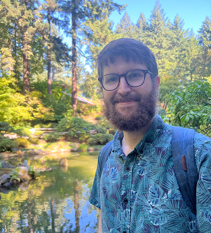 Alex P. Grover surrounded by nature.